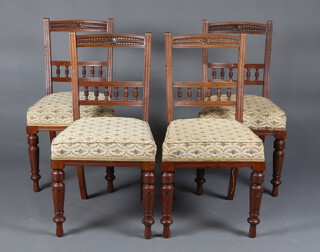 A set of 4 Victorian carved mahogany bar back dining chairs with bobbin turned decoration and over stuffed seats, raised on turned supports 88cm h x 47cm w x 44cm d (seats 28cm x 28cm) 
