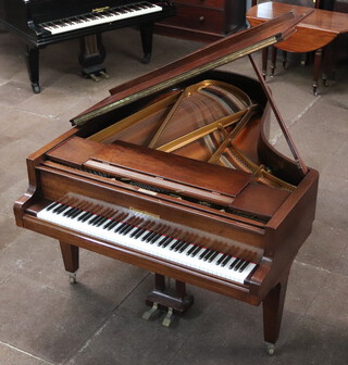 Grotrian-Steinweg, an iron framed, over strung, dampened  baby grand piano serial number 64803 and marked 185 contained in a walnut case raised on square tapered supports 99cm h x 189cm l x 156cm w