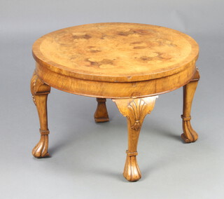 A 1930's circular Queen Anne style figured and crossbanded walnut coffee table raised on cabriole supports 39cm x 60cm 