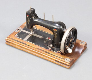 A 19th/20th Century sewing machine 22cm x 39cm x 20cm (no outer case) 