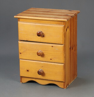 A pine pedestal chest of 3 drawers 53cm h x 41cm w x 30cm d, together with a pine cabinet fitted a shelf above recess, the base enclosed by a panelled door 99cm h x 58cm w x 40cm d (some contact and water marks) 
