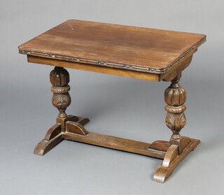 A rectangular oak refectory style coffee table on cup and cover supports with H framed stretcher 51cm h x 68cm w x 43cm d (water and contact marks) 