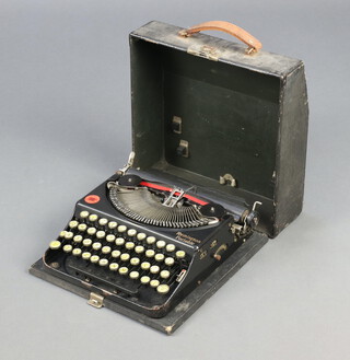 A Remington portable manual typewriter with carrying case 