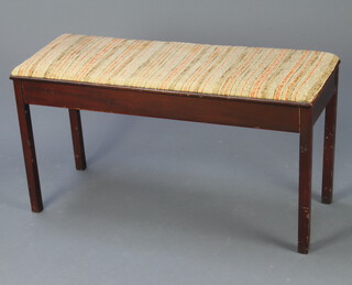 A mahogany box seat duet piano stool with hinged upholstered seat, raised on square supports 48cm h x 94cm w x 36cm d 