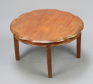 An Edwardian circular mahogany table with shaped edge, raised on square supports 42cm h x 73cm diam. 