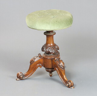 A Victorian walnut revolving adjustable piano stool raised on a platform base 46cm h x 32cm diam. 