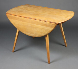 An Ercol light elm drop flap dining table raised on outswept supports 73cm h x 112cm l x 61cm w 