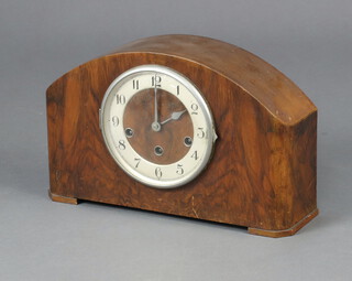 A 1930's chiming mantel clock with silvered dial and Arabic numerals contained in an arched shaped walnut case 22cm x 35cm x 10cm 