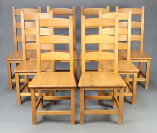 A set of 8 oak ladder back dining chairs with solid seats raised on square supports with box framed stretchers 107cm h x 48cm w x 43cm d (seats 31cm x 31cm) 