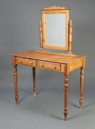 A pine dressing table with mirror, the base fitted 2 drawers, raised on turned supports 145cm h x 96cm w x 50cm d 