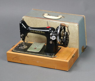 A Singer manual sewing machine complete with instructions 