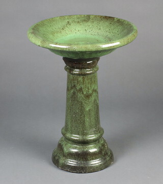A green glazed pedestal bird bath 52cm h x 40cm diam