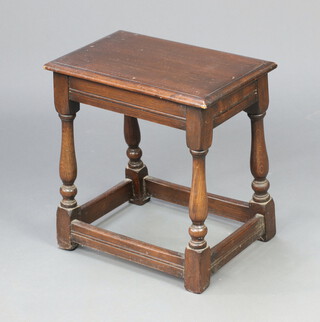 An oak joined stool raised on turned and block supports 46cm h x 44cm w x 28cm d 