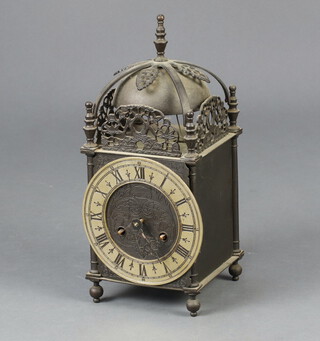 A German reproduction brass cased lantern clock with silvered dial and Roman numerals 30cm h x 15cm w x 15cm d (hour hand is missing) 