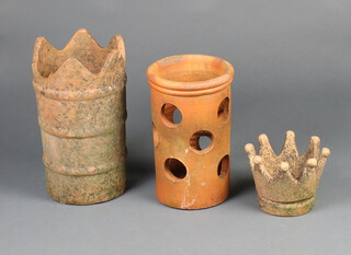 A terracotta crown shaped planter 14cm x 12cm, a terracotta strawberry pot 30cm x 18cm, 1 other planter 34cm x 21cm  
