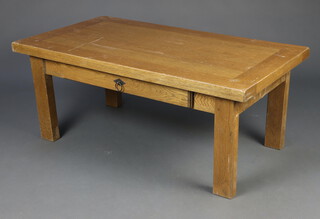 A rectangular oak table on square supports 46cm h x 110cm w x 60cm (some scratches)