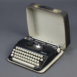 An Olympus Splendid 61 portable manual typewriter complete with carrying case 