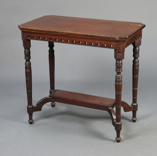 An Edwardian mahogany rectangular 2 tier occasional table raised on turned supports 69cm h x 72cm w x 42cm d 