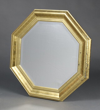 An octagonal bevelled plate wall mirror in a gilt frame 64cm h x 64cm  