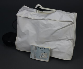 A Singer 348 electric sewing machine, with instructions 