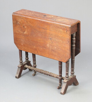 An Edwardian mahogany Sutherland table raised on turned supports 60cm h x 61cm w x 15cm (sun bleached and water marked) 