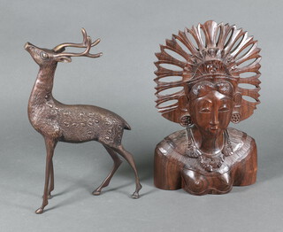 A bronze figure of a standing stag 35cm h x 17cm w x 5cm d and a Balinese carved head and shoulders portrait bust of a lady 31cm h x 19cm w x 8cm d 