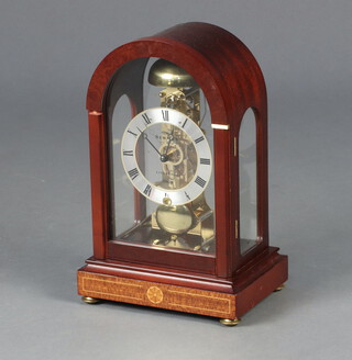 Sewills of Liverpool, an Edwardian style skeleton clock with silvered dial, chapter ring and Roman numerals, contained in an arch shaped inlaid mahogany case 29cm h x 19cm w x 14cm d 