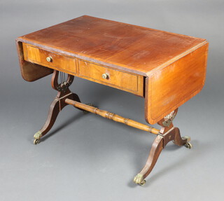 A Georgian style crossbanded mahogany sofa table fitted 2 drawers, raised on lyre supports 74cm h x 94cm w x 61cm d (some crude repairs to the base) 