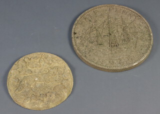 A circular concrete stepping stone decorated a walking fox 32cm, together with 1 other in the form of a 1965 half penny 42cm 