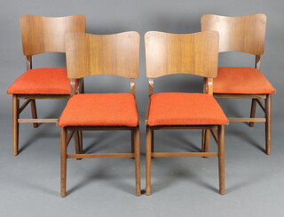 A mid-Century set of 4 teak slat back dining chairs raised on shaped supports 79cm h x 43cm w x 41cm 
