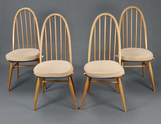 Ercol, a set of 4 elm and beech hoop stick back dining chairs, raised on turned supports 96cm h x 40cm w x 39cm d (2 have splits to the backs, all have contact marks) 
