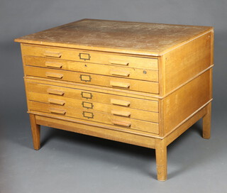 An oak 6 drawer plan chest raised on square tapered supports 89cm h x 120cm w x 86cm (some scratches to the top, water marks and 6 small holes) the chest is in 2 sections  