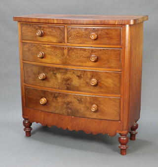 A Victorian mahogany bow front chest of 2 short and 3 long drawers with turned handles, raised on turned support 125cm h x 121cm w x 52cm d (sun bleaching to top) 