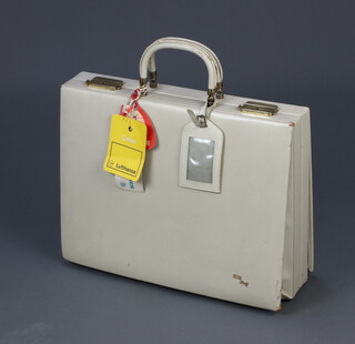 A vintage white leather vanity case 31cm h x 40cm w x 15cm d 