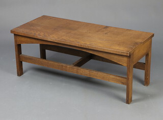 An Art Nouveau style rectangular oak coffee table with H framed stretcher 42cm h x 101cm w x 45cm d 