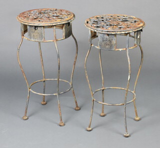 A pair of circular pierced wrought iron jardiniere stands raised on cabriole supports 62cm h x 33cm diam. 