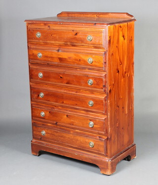 A pine chest with raised back and 6 drawers, on bracket feet 131cm h x 86cm w x 44cm d 