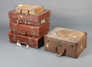 A leather and fibre suitcase with some destination labels 27cm x 56cm x 42cm, 3 other suitcases and an attache case 