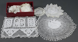 A quantity of table laces contained in a shoe box 
