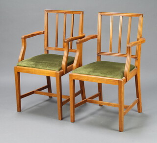 A pair of Georgian style mahogany stick and rail back carver chairs with upholstered drop in seats raised on square supports with H framed stretchers 90cm h x 54cm w x 44cm d (seat 22cm x 25cm, some contact marks in places) 