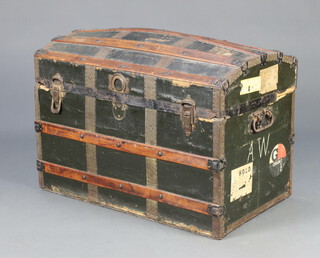 A Victorian domed wooden and fibre bound cabin trunk with iron drop handles 58cm x 84cm x 49cm (hinge a/f)