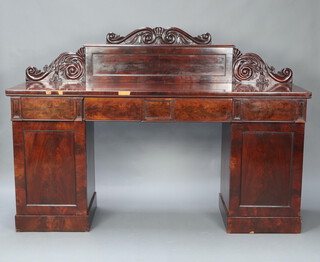 A William IV carved mahogany pedestal sideboard with raised carved back, the apron fitted 4 drawers, the pedestals enclosed by panelled doors 133cm h x 191cm w x 56cm d