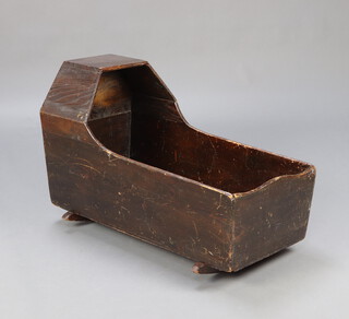 A child's 19th/20th Century elm rocking crib 58cm h x 88cm w x 42cm d, the interior 83cm x 35cm  