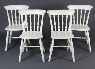 A set of 4 white painted Windsor style stick and bar back kitchen chairs on turned supports with H framed stretcher 82cm h x 39cm w x 39cm d (seats 27cm x 26cm) 