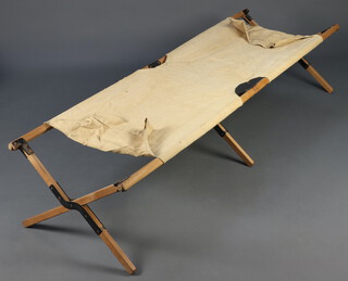 A First World War wooden and metal folding camp bed 