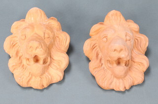 A pair of terracotta lion masks 19cm x 16cm 