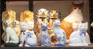 A pair of reproduction Staffordshire Spaniels 28cm, a collection of ceramic dogs and cats 