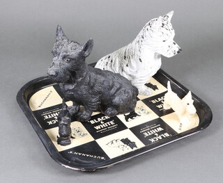 A Black and White Scotch Whisky advertising tray, a pair of metal black and white dogs and a pair of composition ditto 