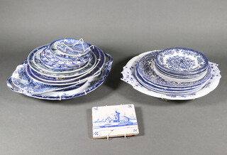 A Delft tile and a quantity of blue and white transfer print china PLEASE NOTE The four blue and white floral side plates in the image are no longer included in this lot