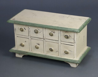 A Continental miniature white and turquoise painted hardwood chest of 8 short drawer, raised on bracket feet 24cm h x 44cm w x 21cm d 